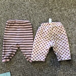 2 pairs warm newborn size pants, 1 knit 1 2 layer quilted and reversible!